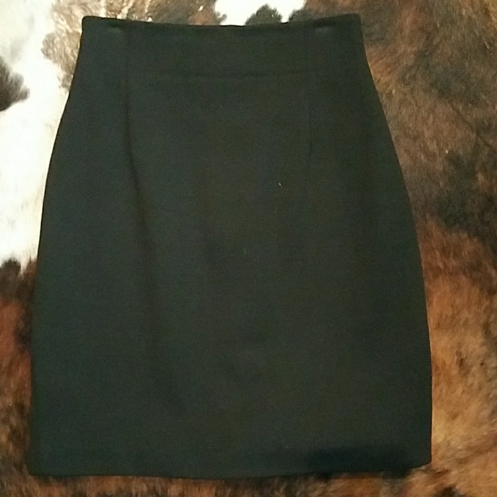 Slimming black pencil skirt with rear kick pleat